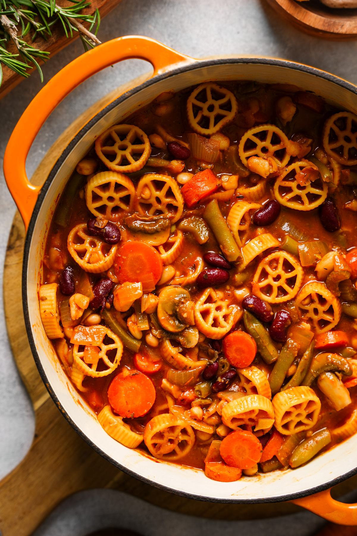 looking down at the bowl of vegan minestrone soup in a soup pot