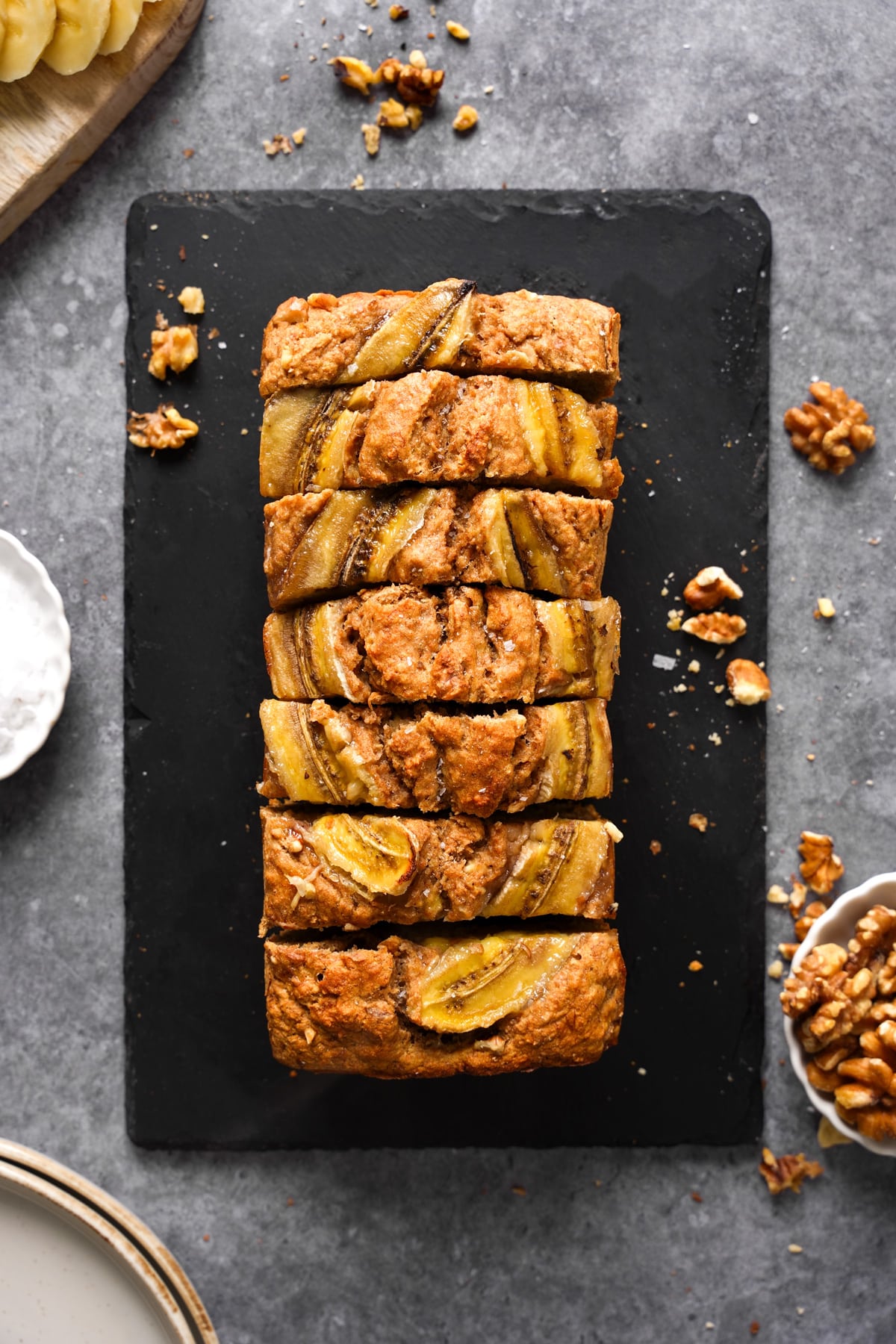 the spelt flour banana bread sliced  with walnuts around it