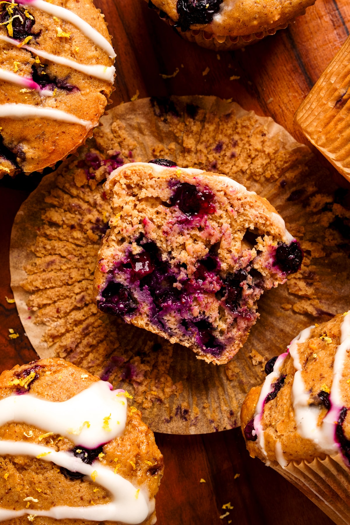 looking down at one of the vegan lemon blueberry muffins cut in half to show the fluffy texture