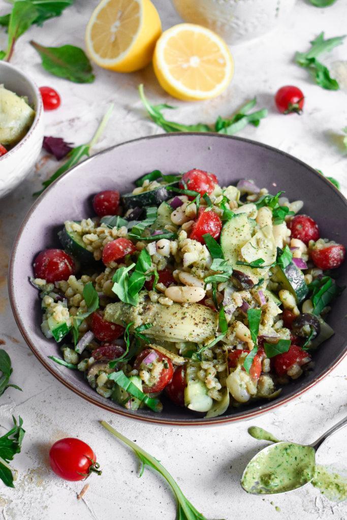 barley pesto salad with cucumbers, tomatoes, basil, and artichokes