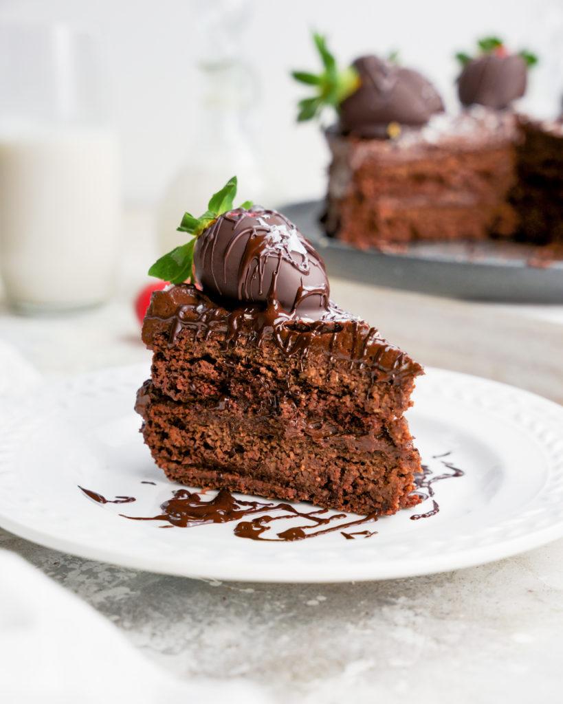 healthy vegan chocolate cake slice with chocolate drizzle