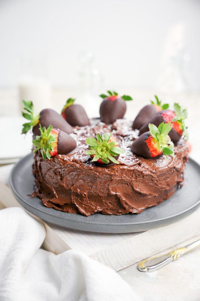 The cake with chocolate covered strawberries smooth creamy avocado chocolate frosting