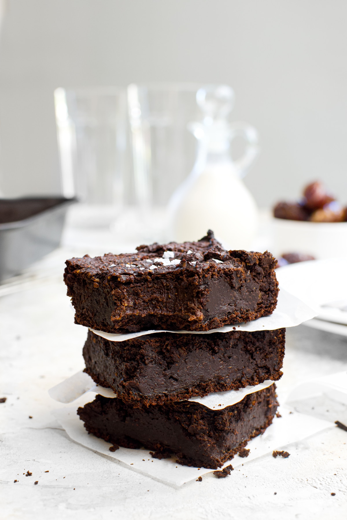 date sweetened brownies with a bite taken out of them to show the texture