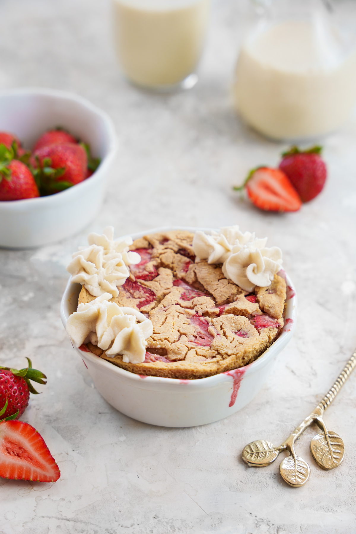 Strawberry baked oats recipe with vegan frosting close up