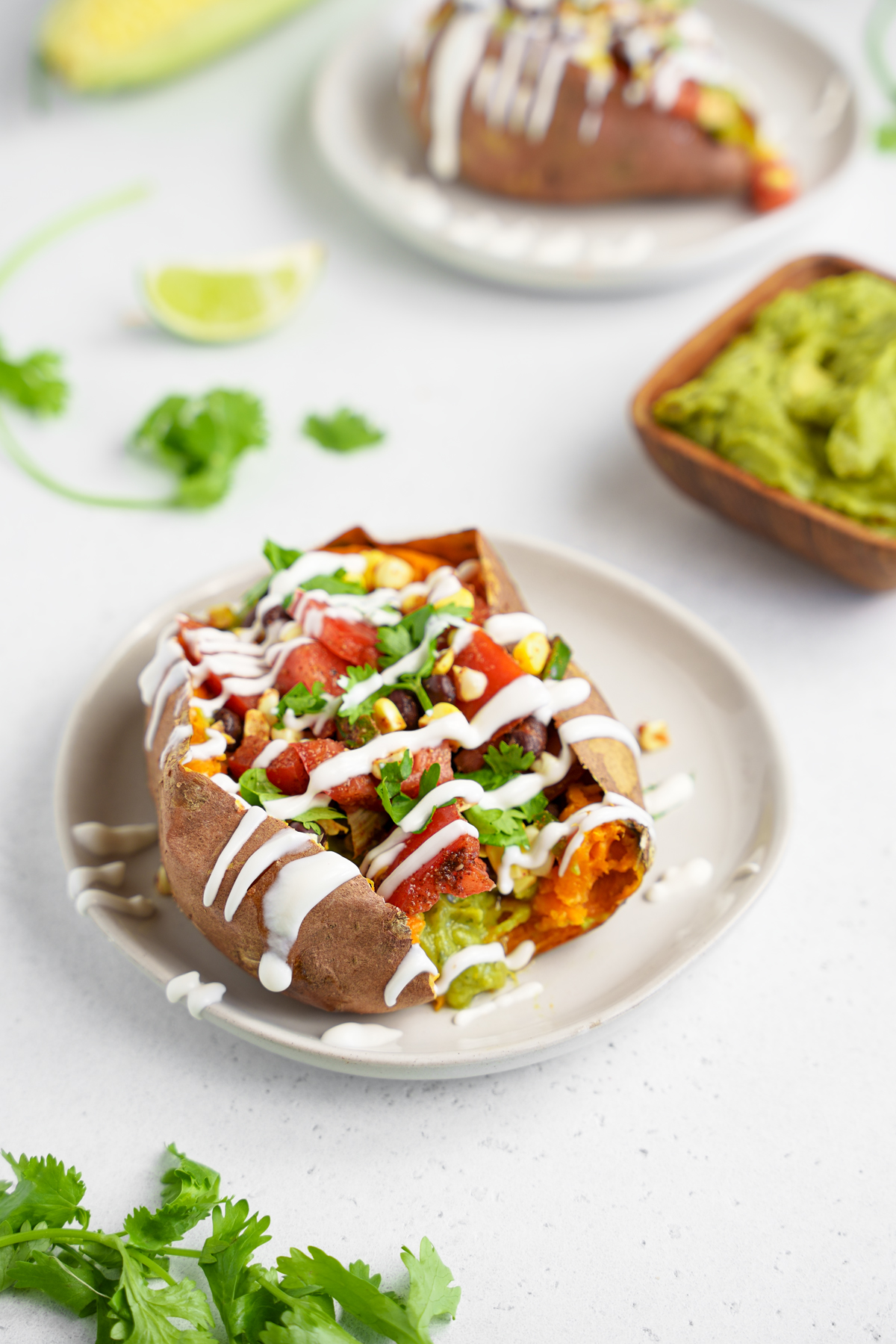 the vegan taco stuffed sweet potato with vegan sour cream on top