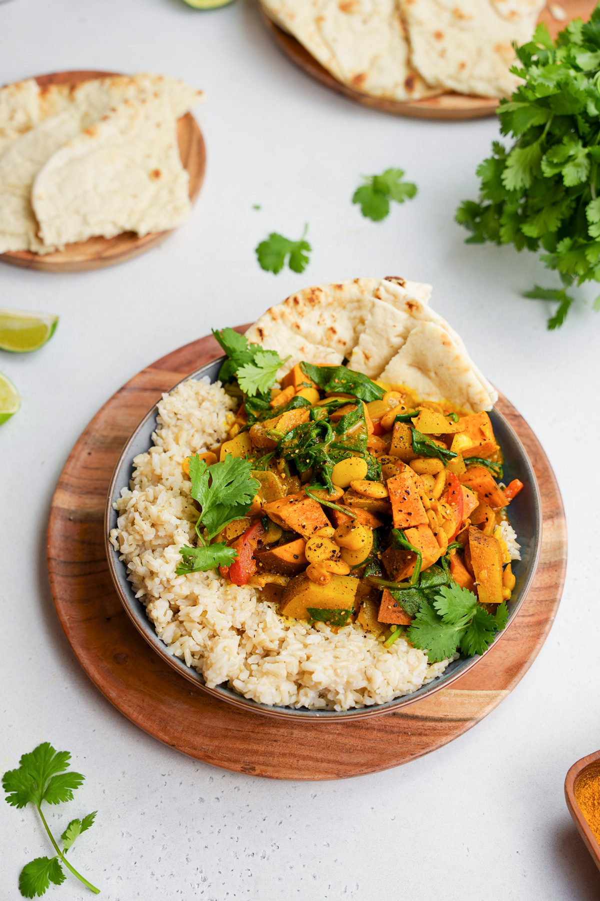 the butter beans in curry served over rice with sweet potatoes and russet potatoes