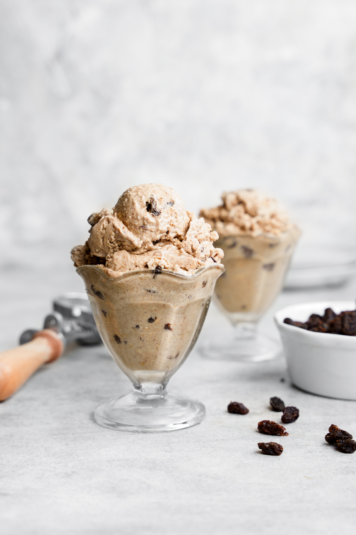 the oatmeal raisin ice cream scooped into ice cream cups