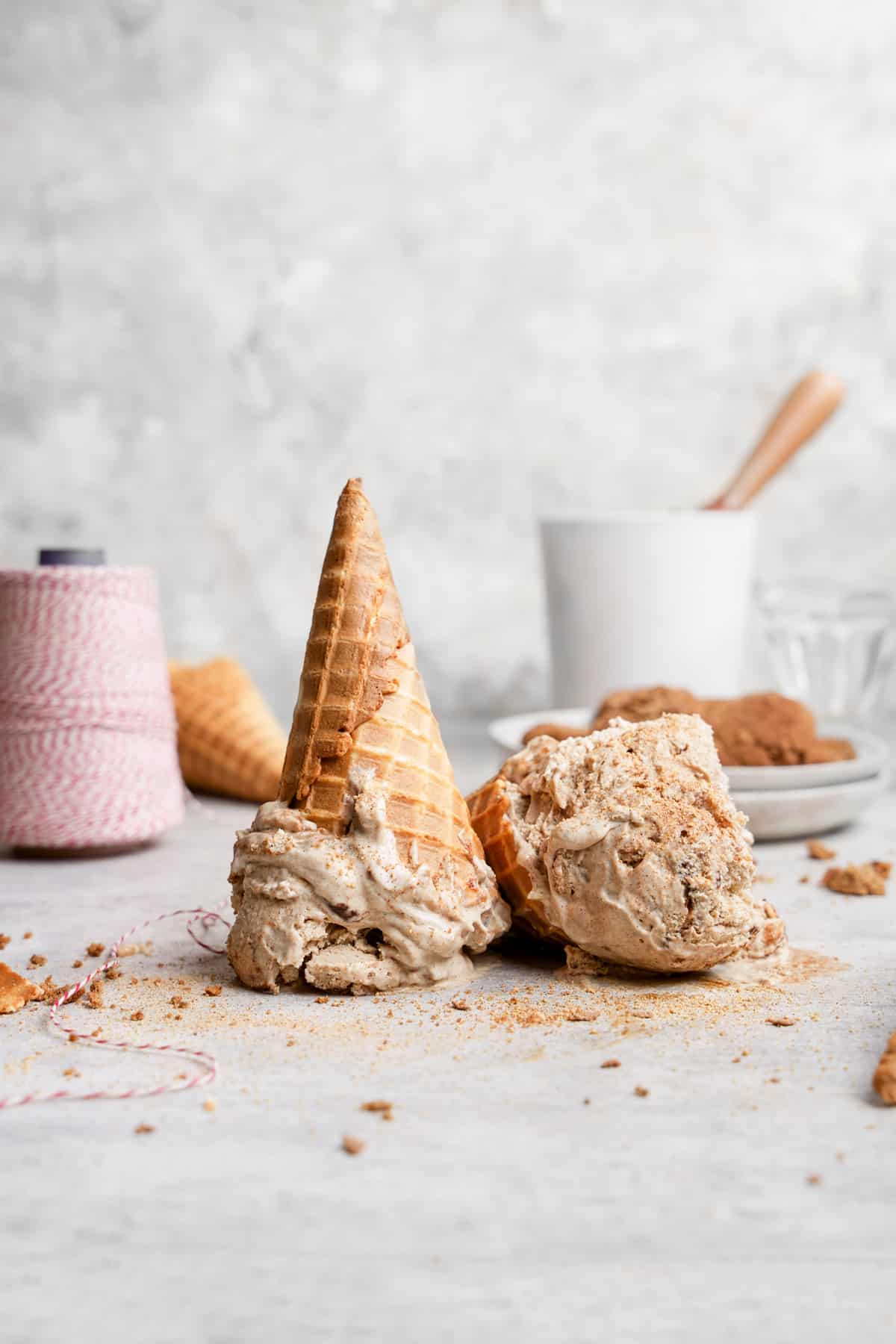 the snickerdoodle ice cream in cones turned upside down and smashed into the surface