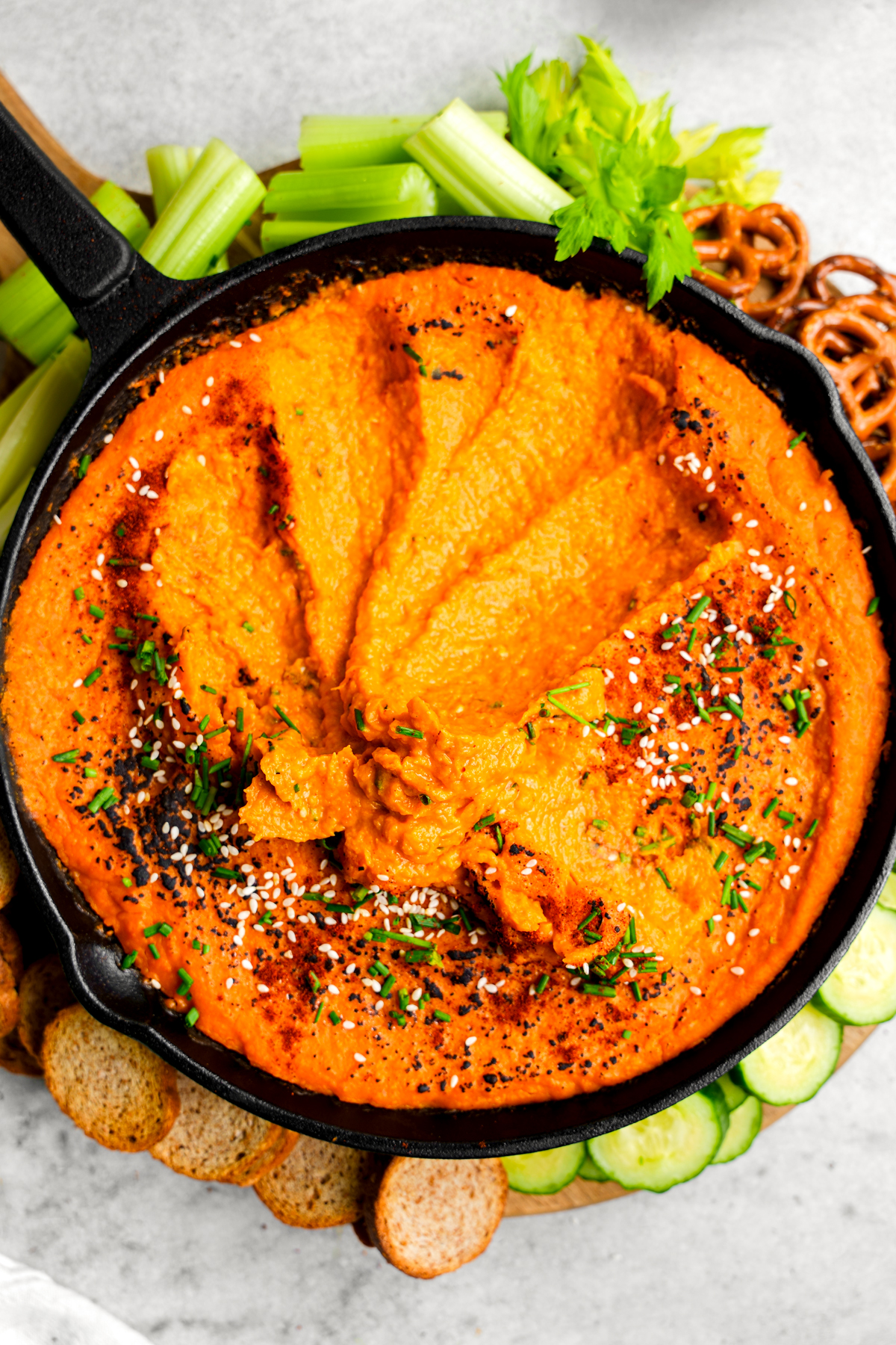 the vegan appetizer with scoops taken out of it