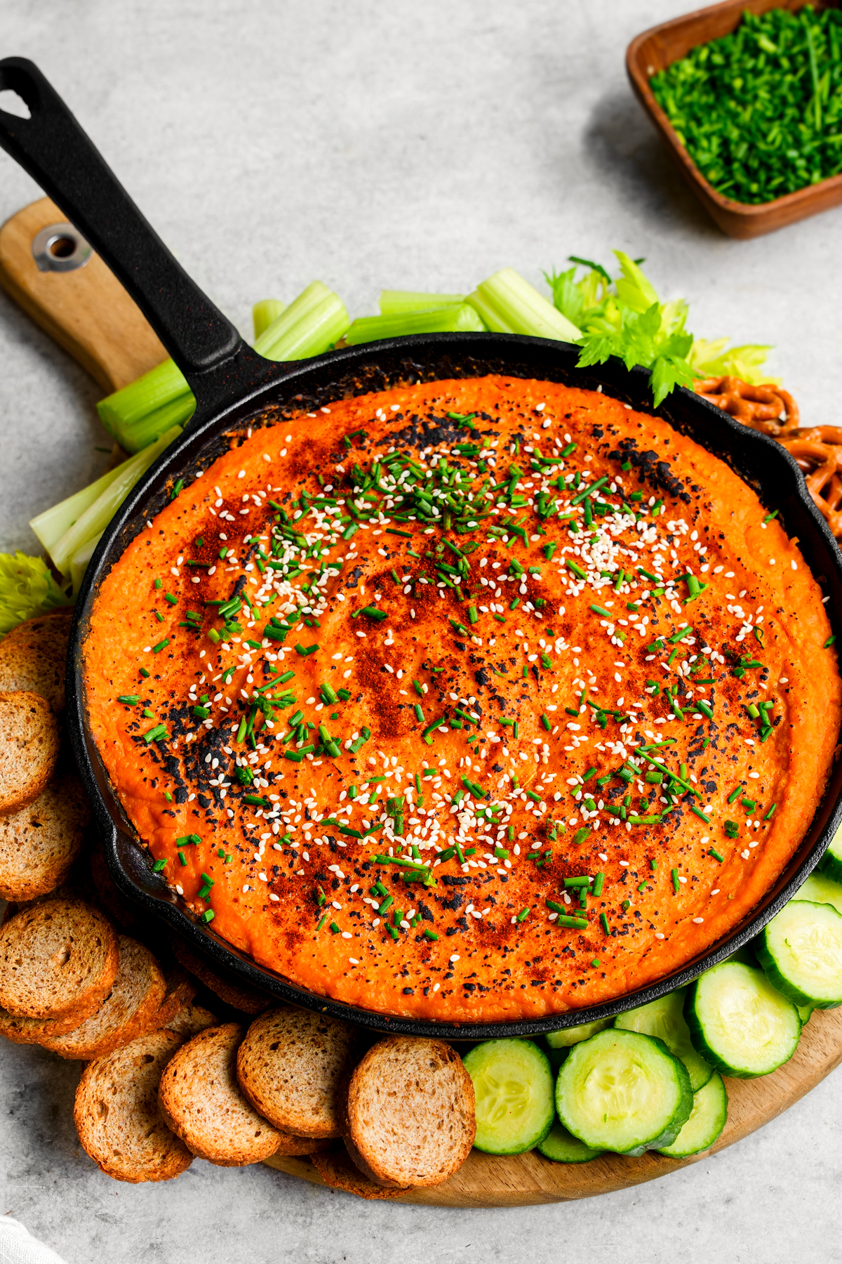 the butternut squash dip with the dipping ingredients on the plate with it