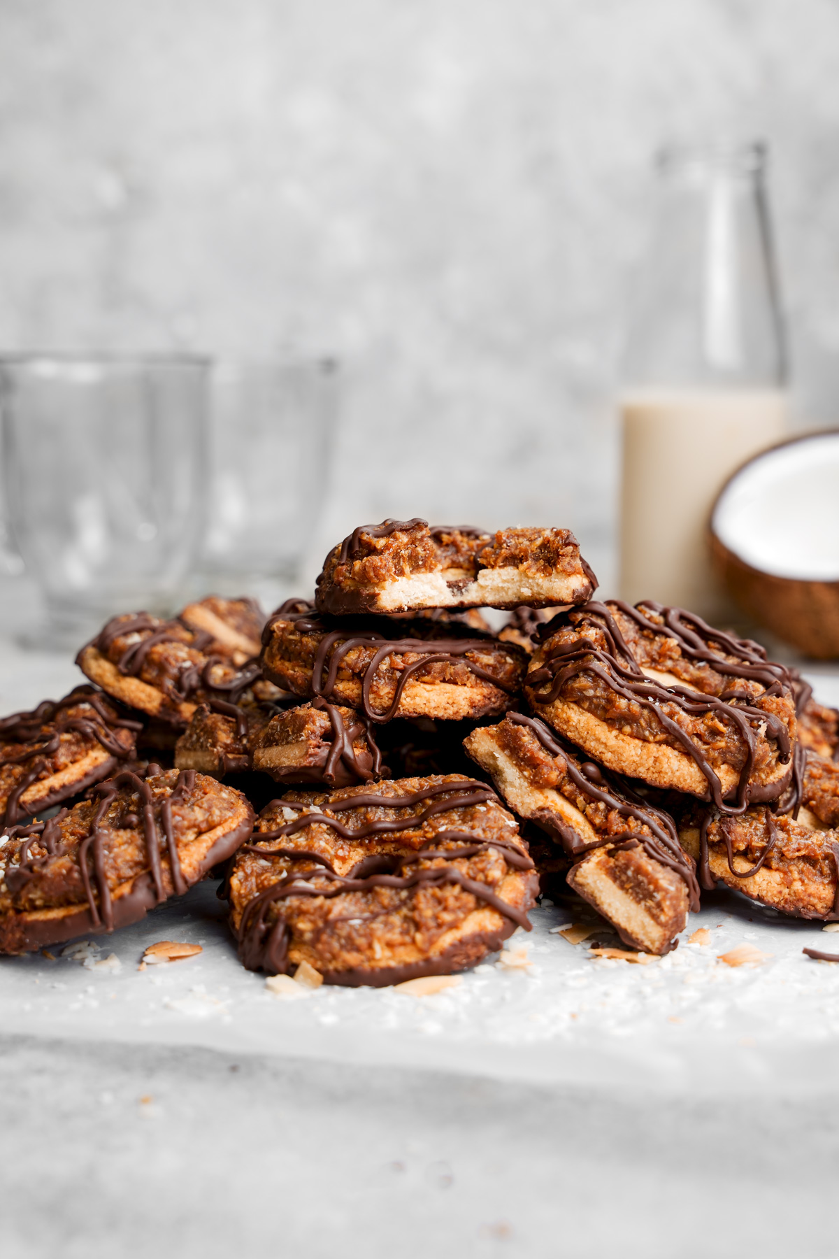 the gluten-free vegan somaos all piled up. Some cut in half, some whole, and one with a bite taken out of it