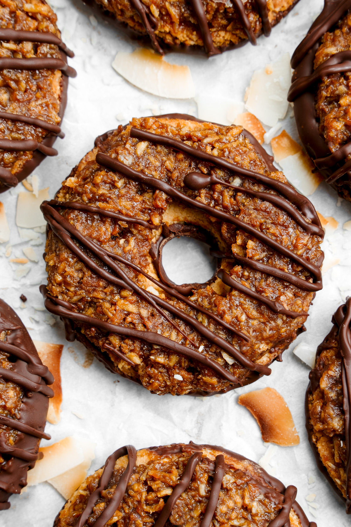 close up of the vegan samoas to show the gooey caramel and chocolate top