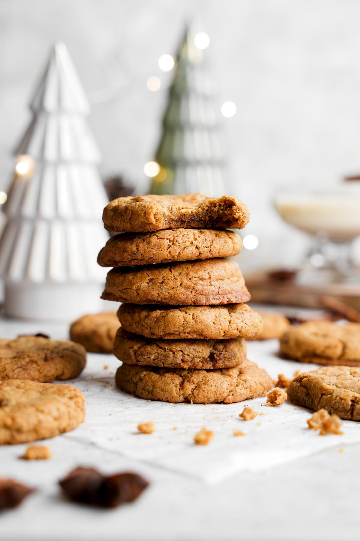 the vegan eggnog cookies stacked on top of each other