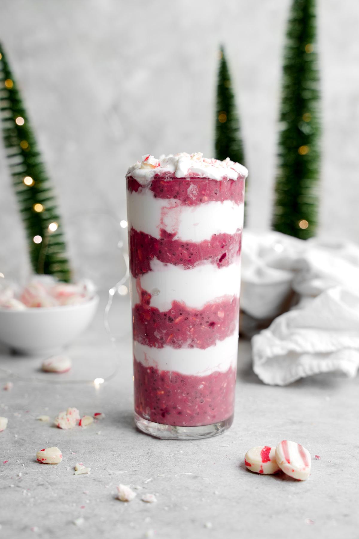 the candy cane oatmeal with christmas trees in the background