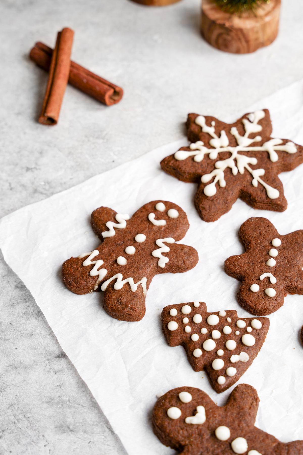 the decorated plant based christmas cookies on parchment paper