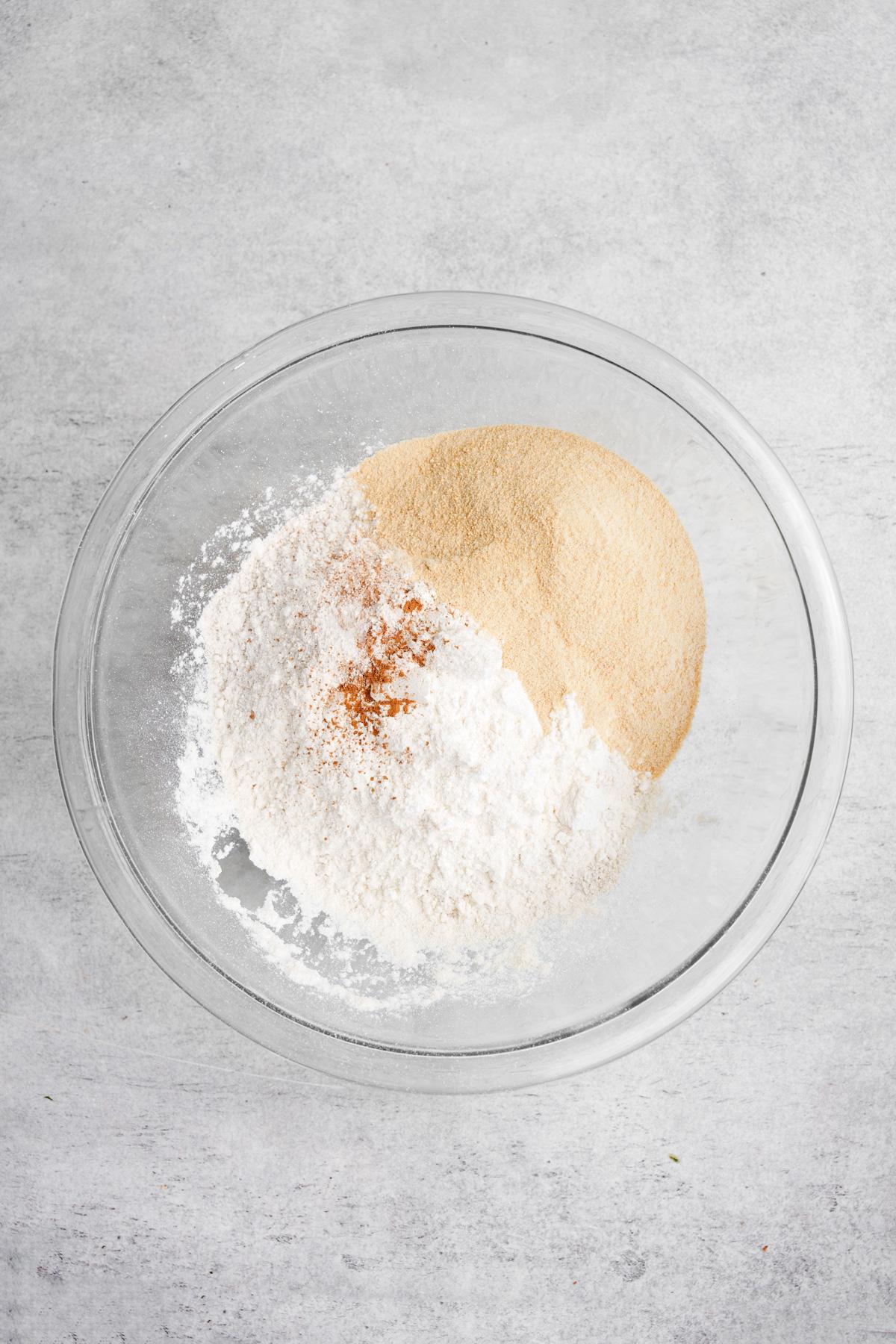 adding the dry ingredients to the bowl