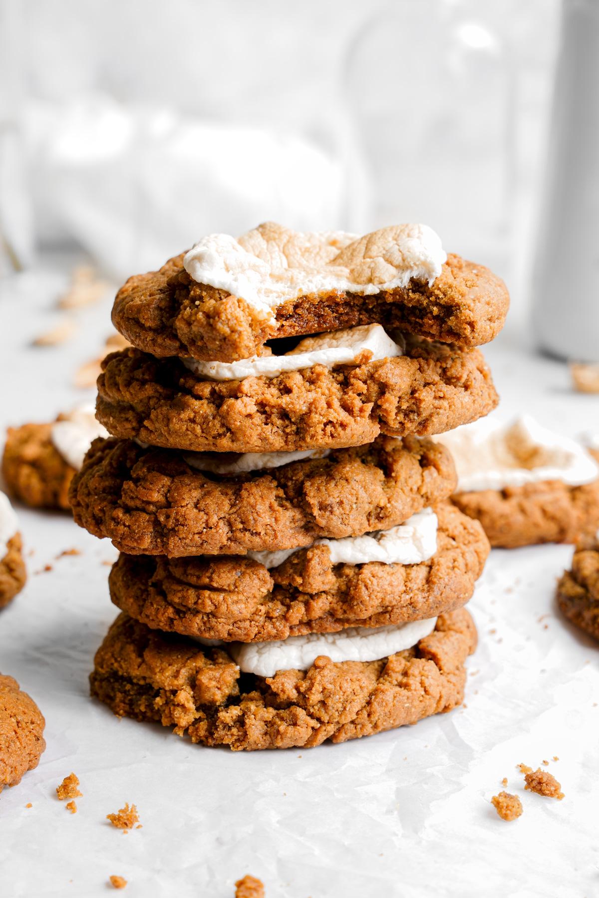 the fluffernutter cookies stacked on top of each other with a bite taken out of one