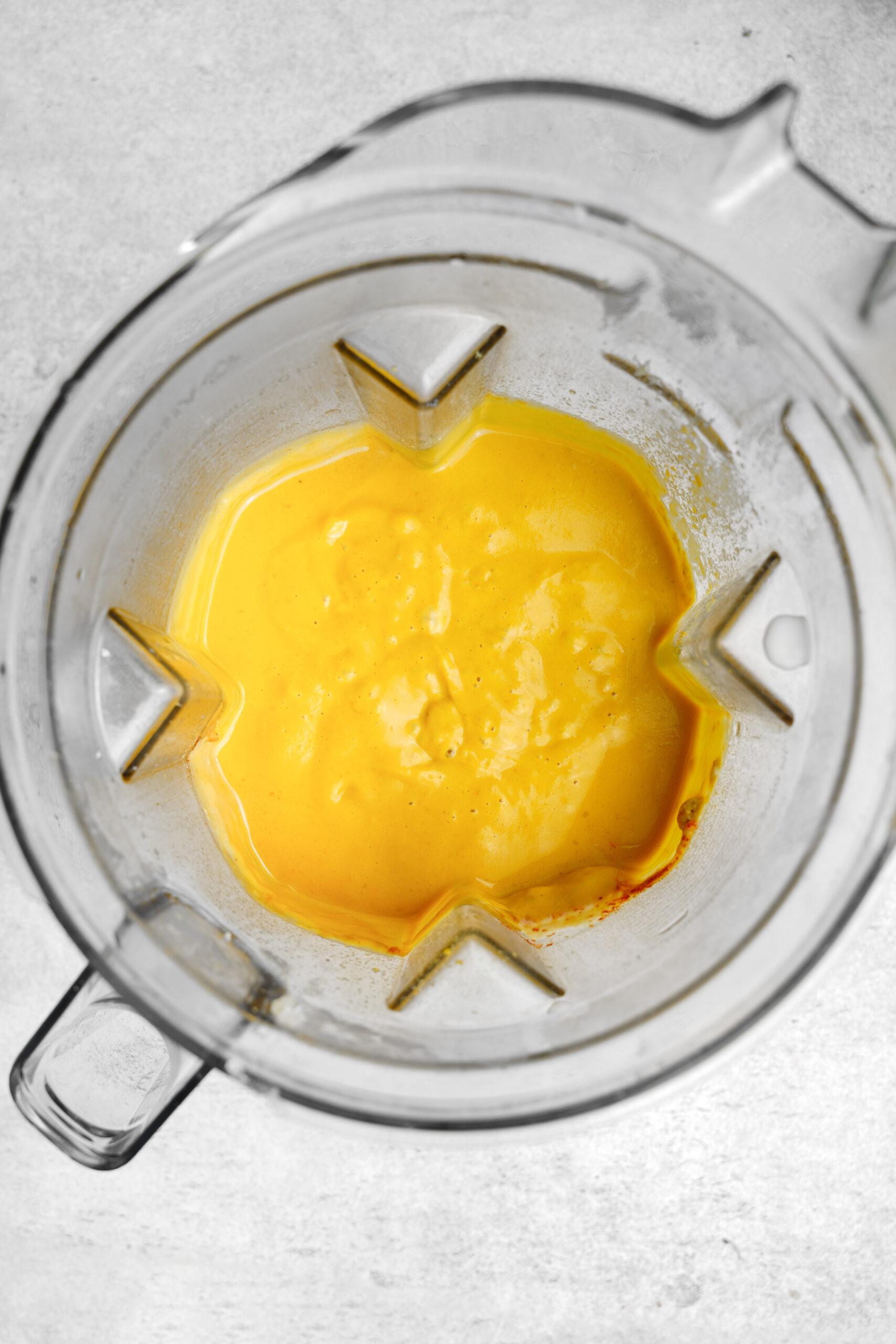 blending the vegetables into a creamy cheese sauce.