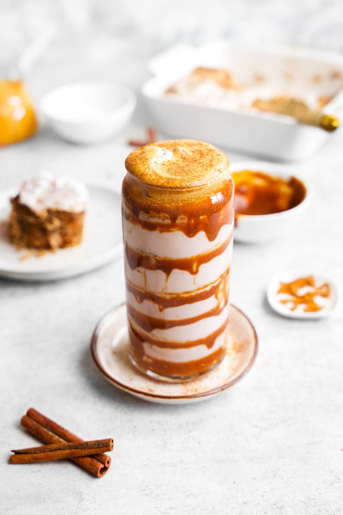 close up of the cinnamon roll latte showing the whipped coffee on top