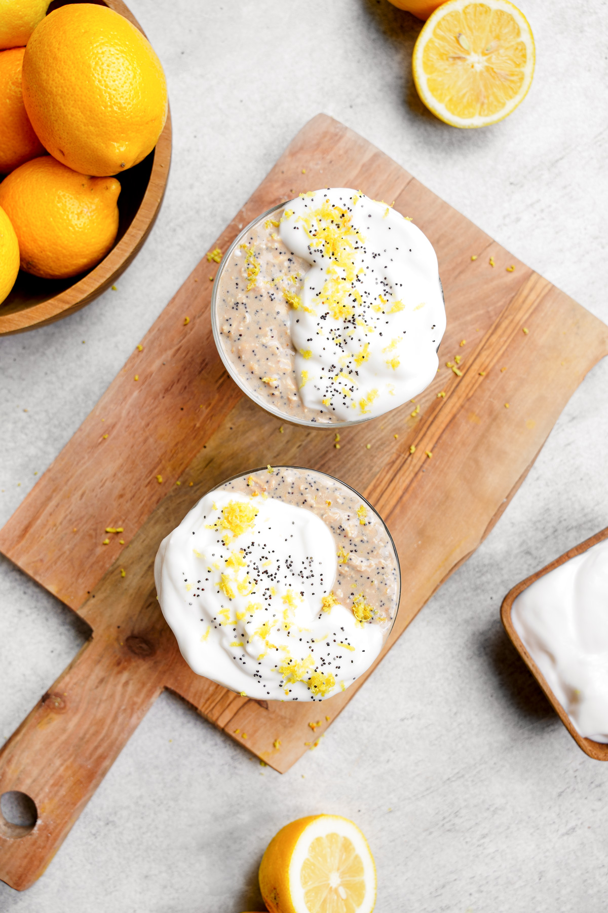 looking down at the lemon poppyseed overnight oats recipe with fresh vegan yogurt and lemon zest on top