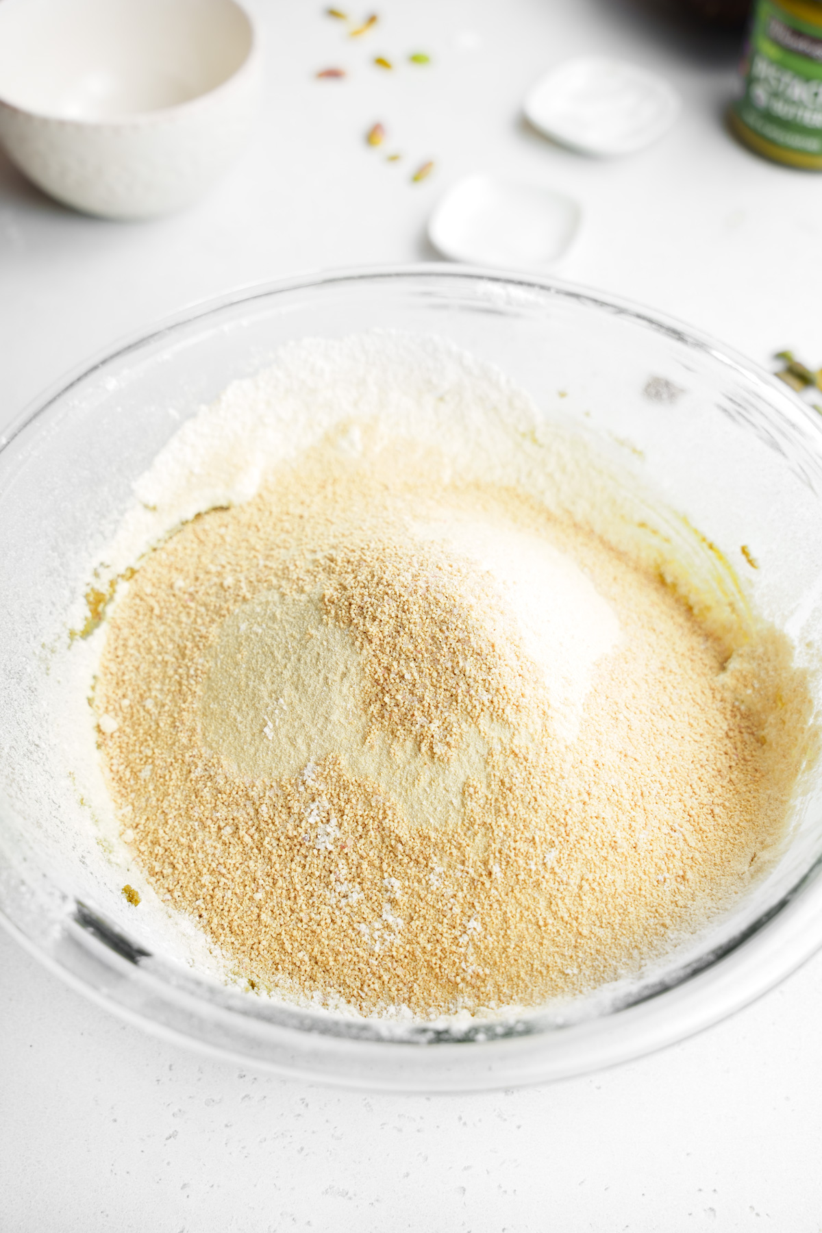sifting the dry ingredients into the wet ingredients