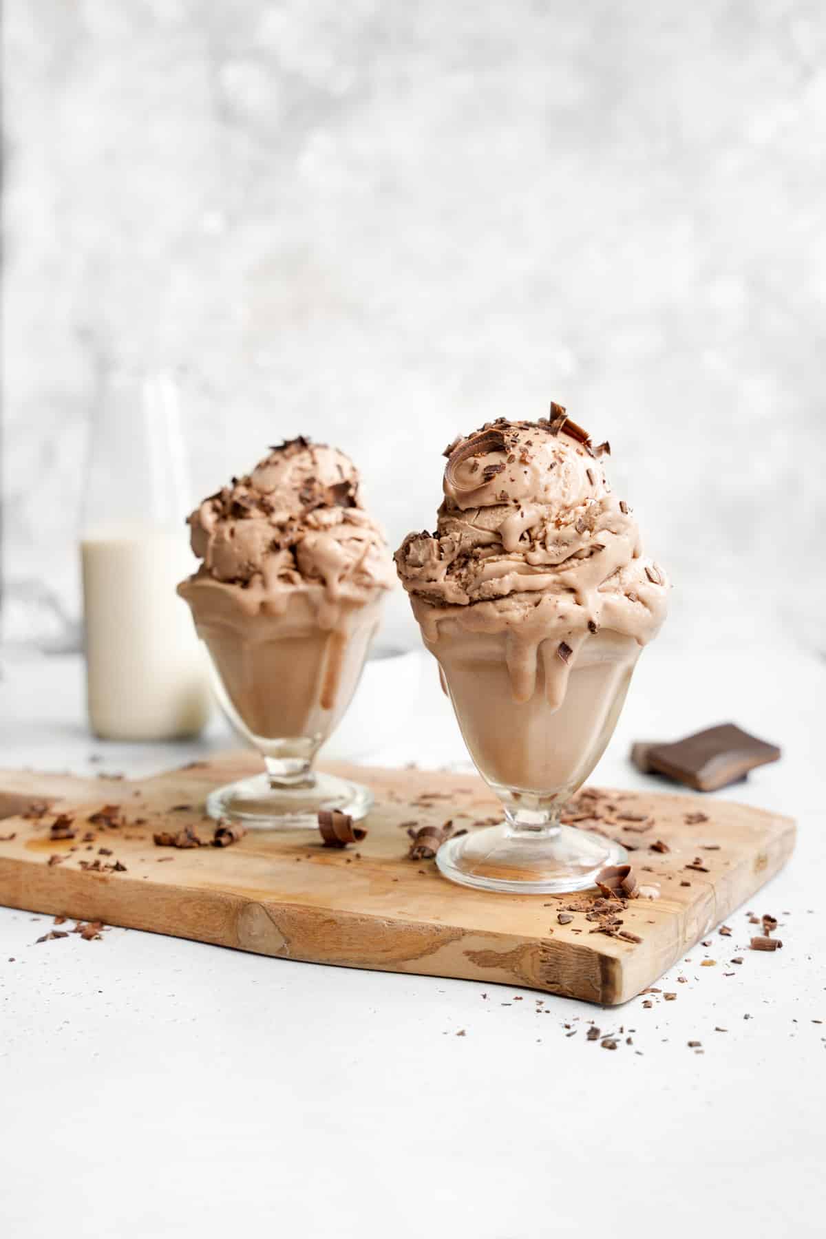 two cups of the protein ice cream with shaven chocolate on top