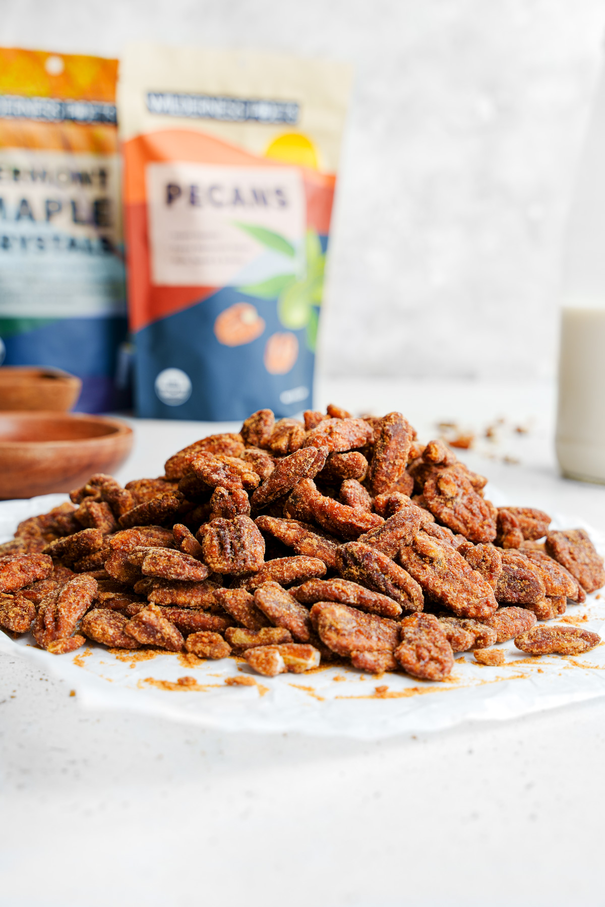 the crunchy maple candied pecans with the wilderness poets bags in the back