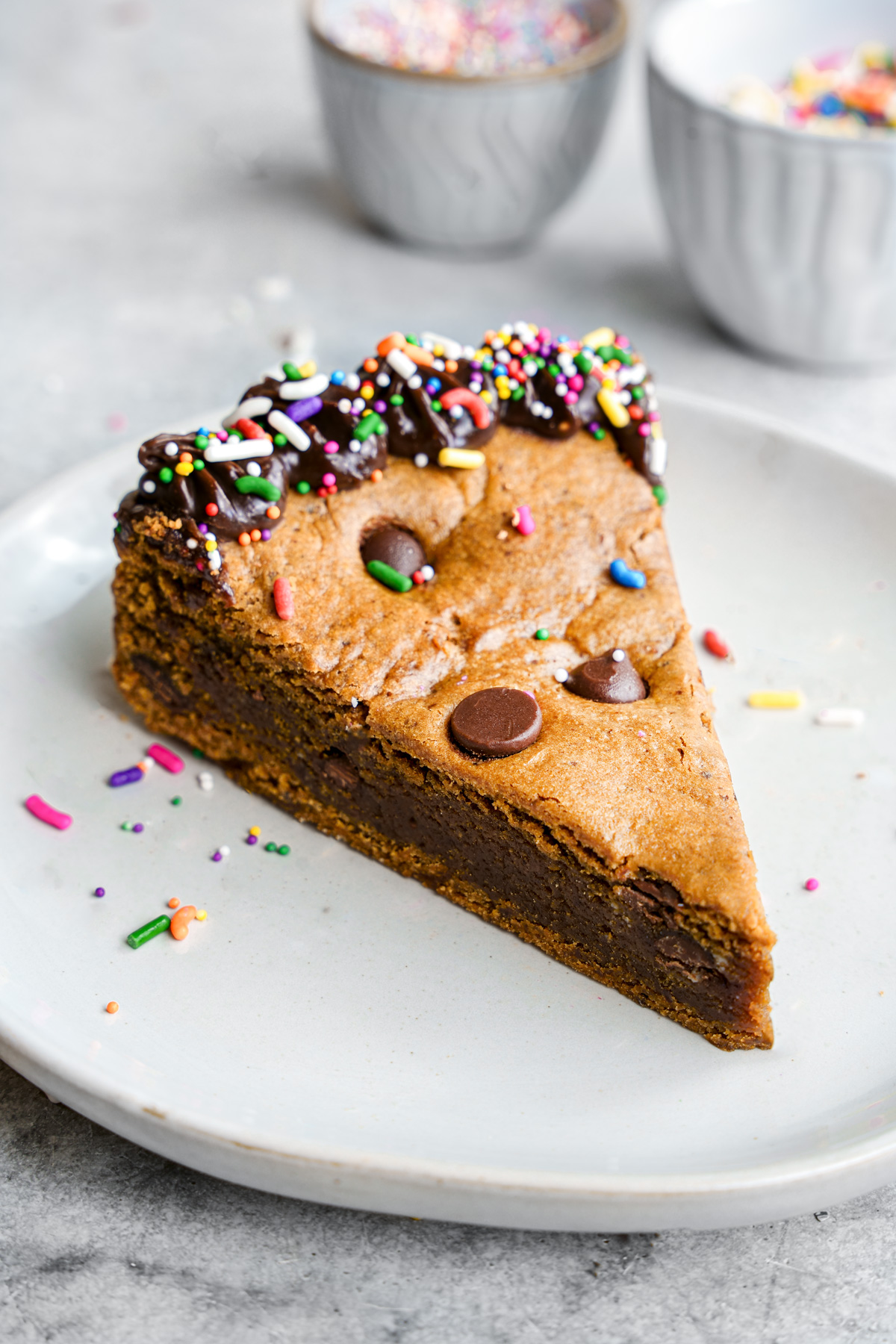 a close up of a slice of the gluten-free vegan cookie cake