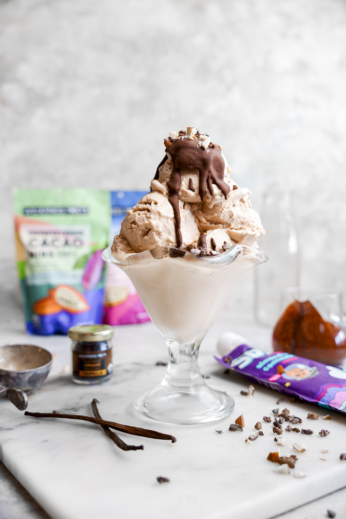 the vegan vanilla ice cream with the vegan magic shell and ice cream toppings