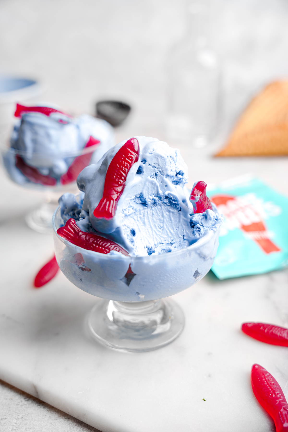 a bowl of the candy ice cream with a scoop taken out of it to show the rich and creamy texture