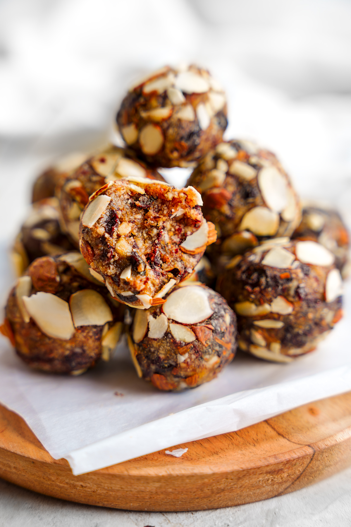 a close up of the cherry balls with a bite taken out of one to show the chewy texture