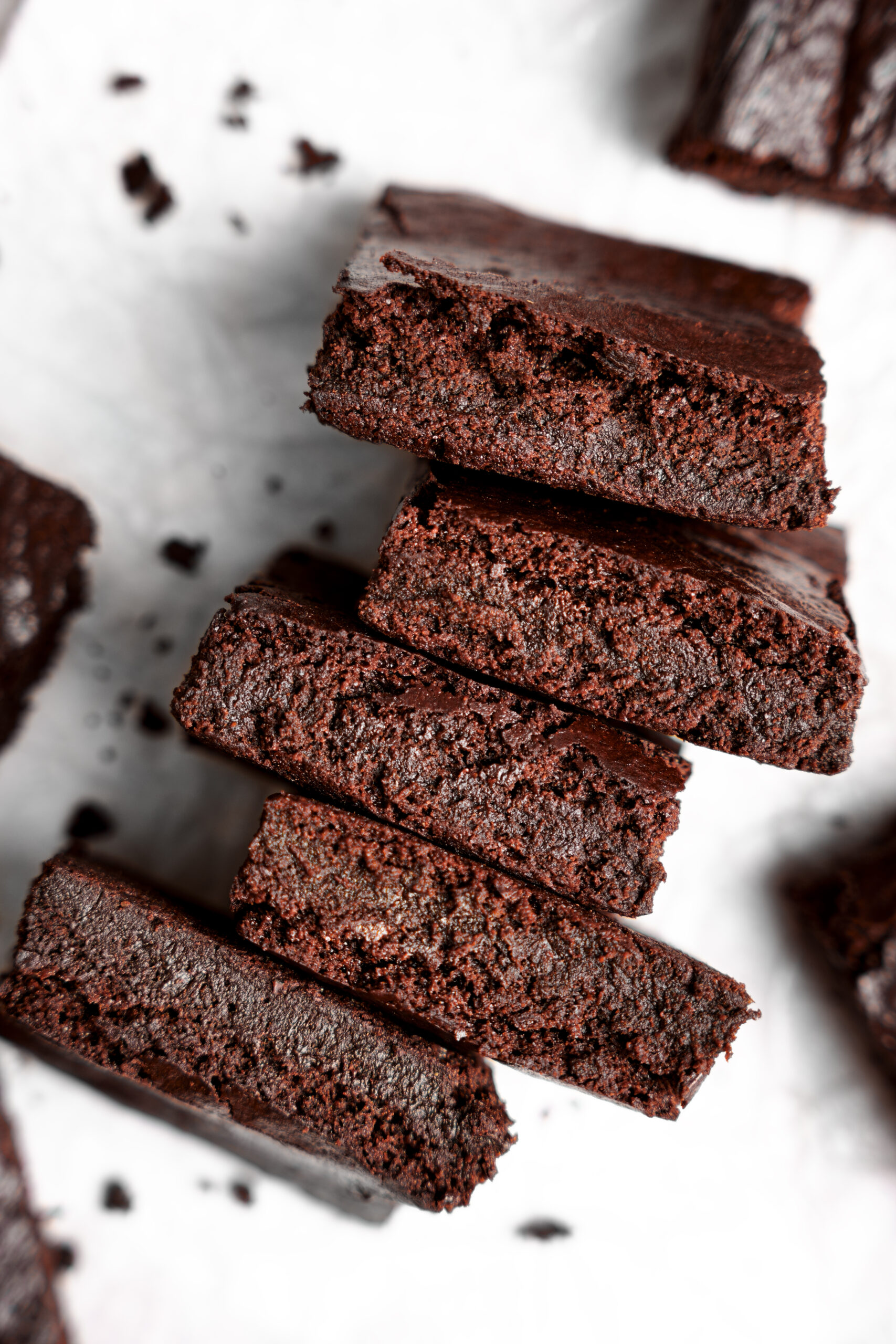 looking down at the brownies on their side to show the chewy texture