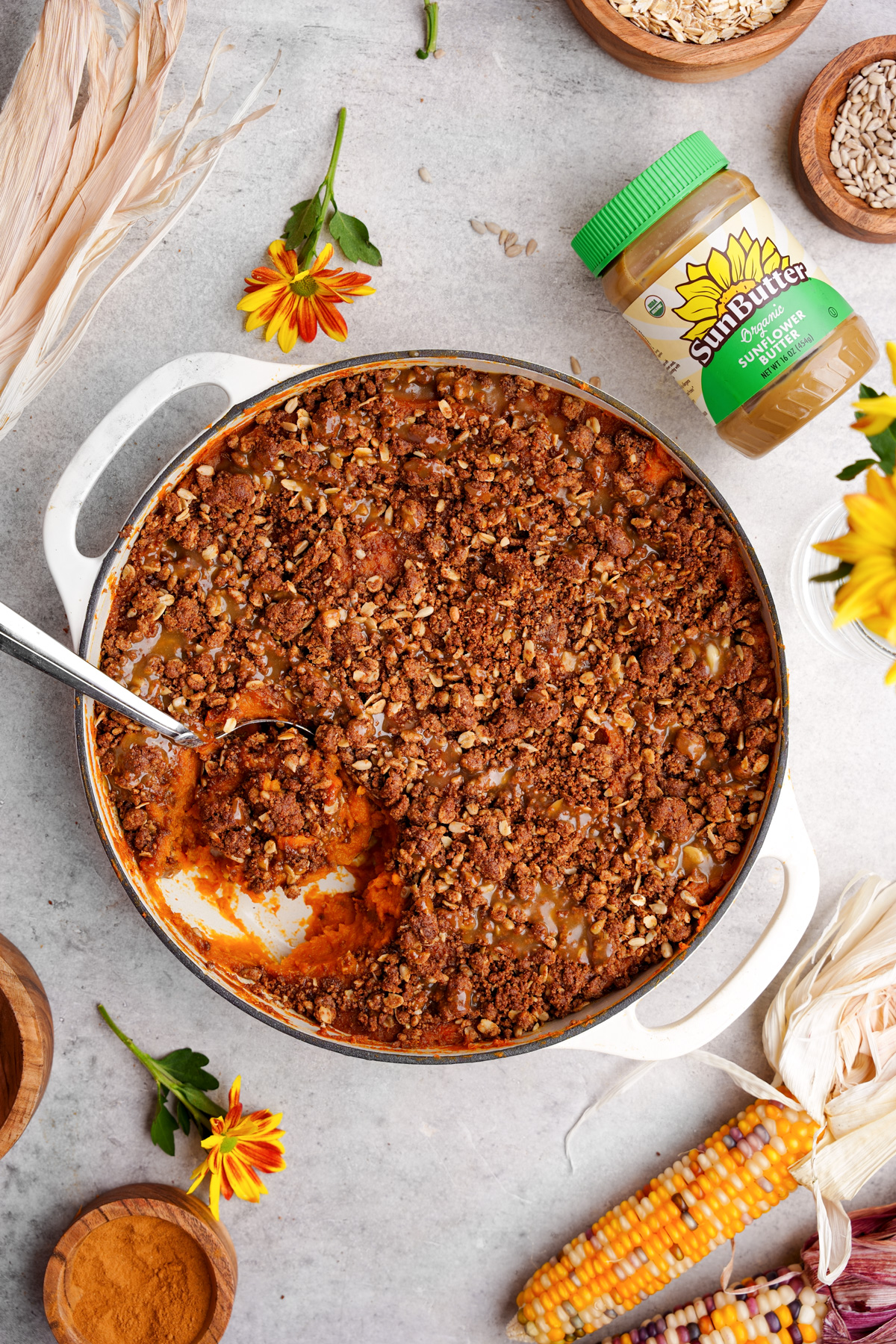 looking down at the sweet potato casserole with a spoon scooping the mixture