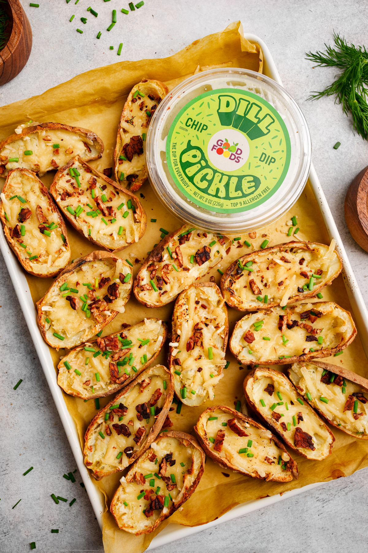 the loaded potato skins on a baking sheet with the dill pickle dip