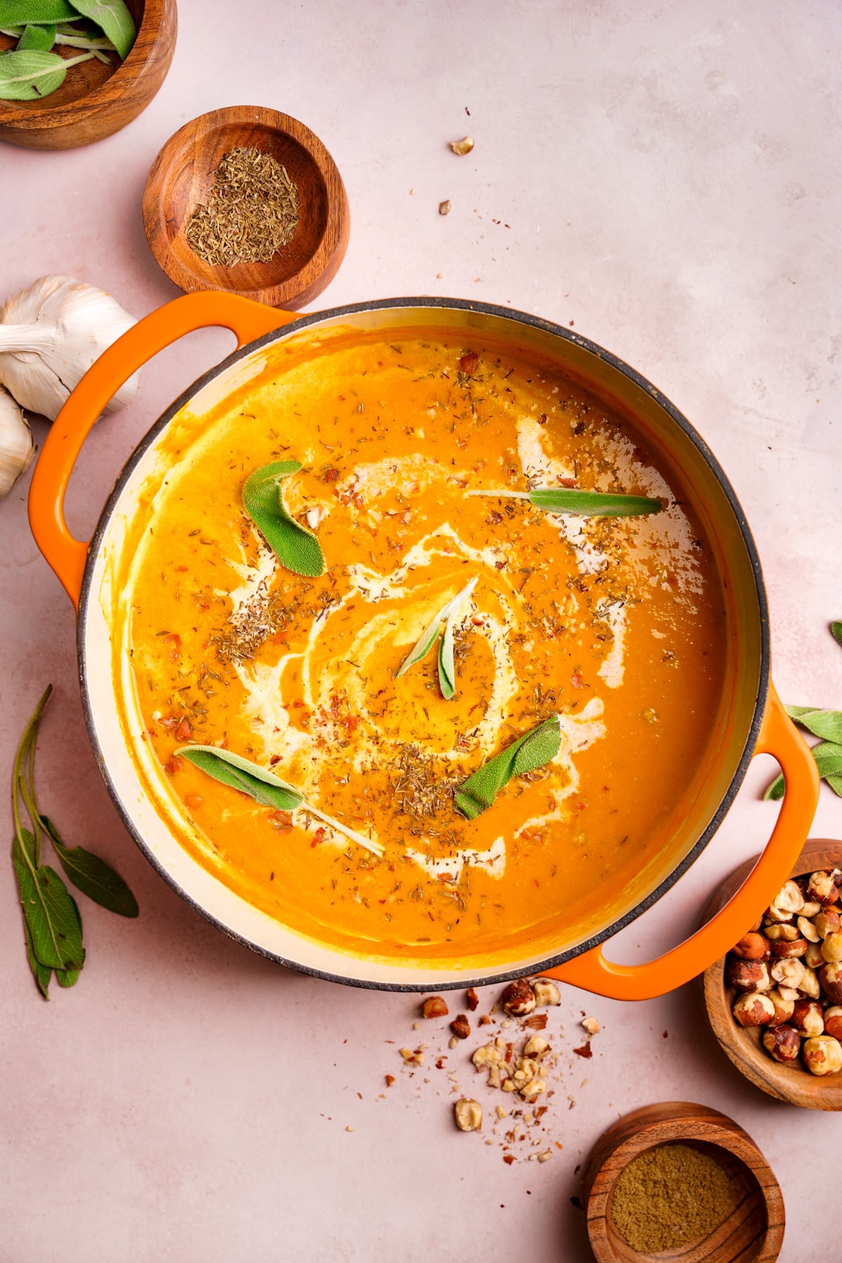 looking down at the creamy vegan butternut squash soup in a large soup pot