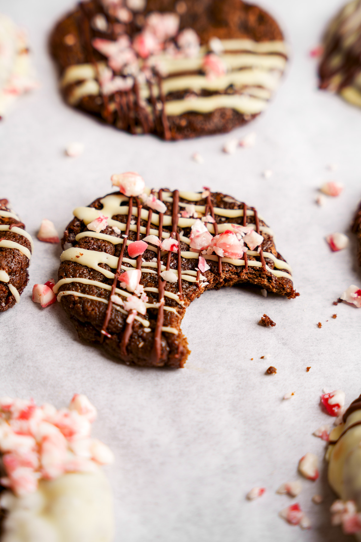 a vegan peppermint mocha cookie with a bite taken out of it to show the chewy texture