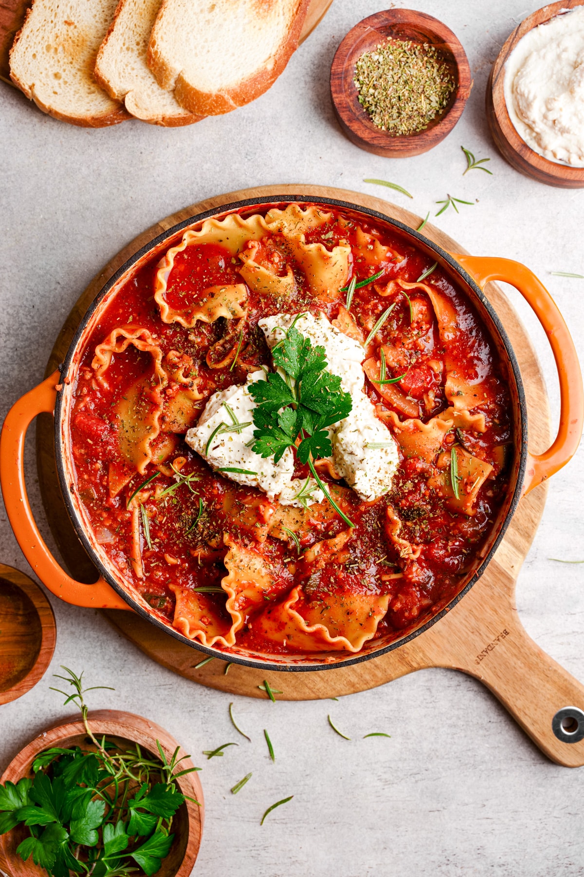 looking down at the easy vegan lasagna soup with scoops of the tofu ricotta on top