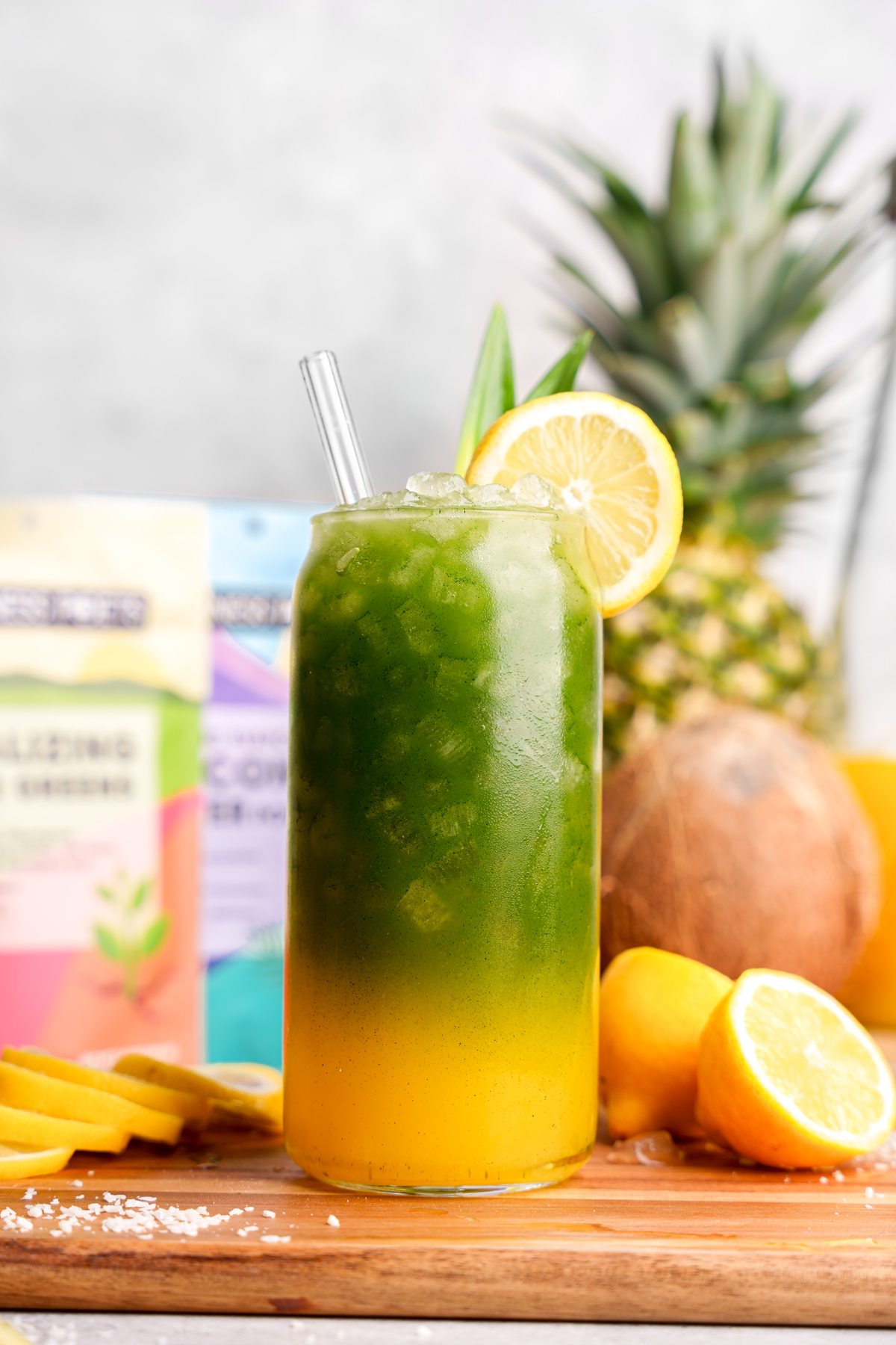 close up of the alkaline green juice with a straw