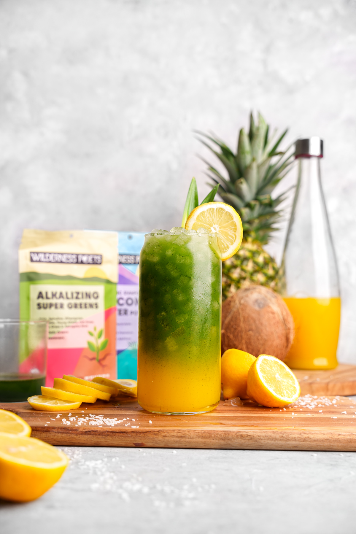 the alkaline green juice next to the wilderness poets products and fresh fruits