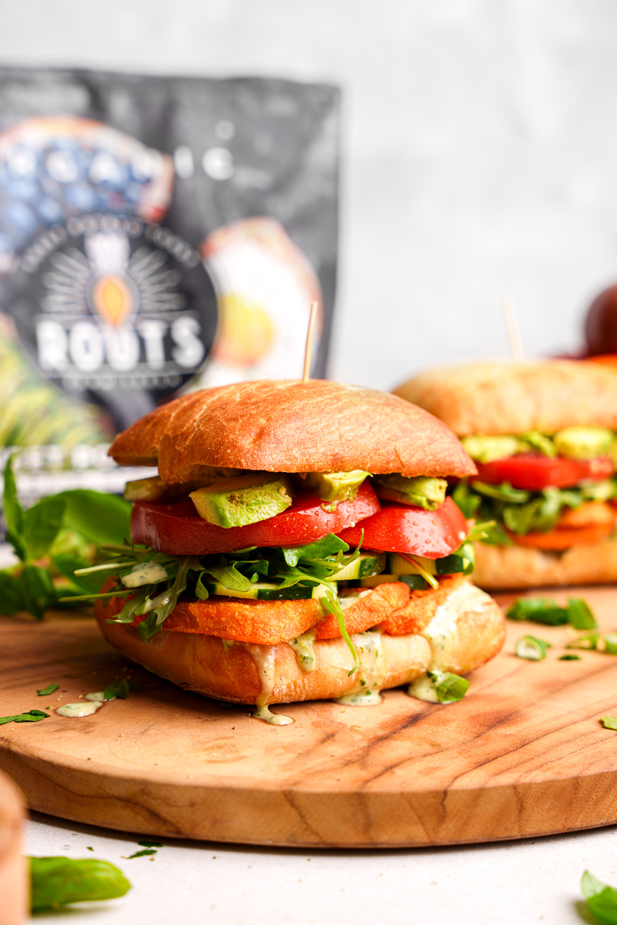 the sweet potato sandwich with the roots farm fresh bag next to it