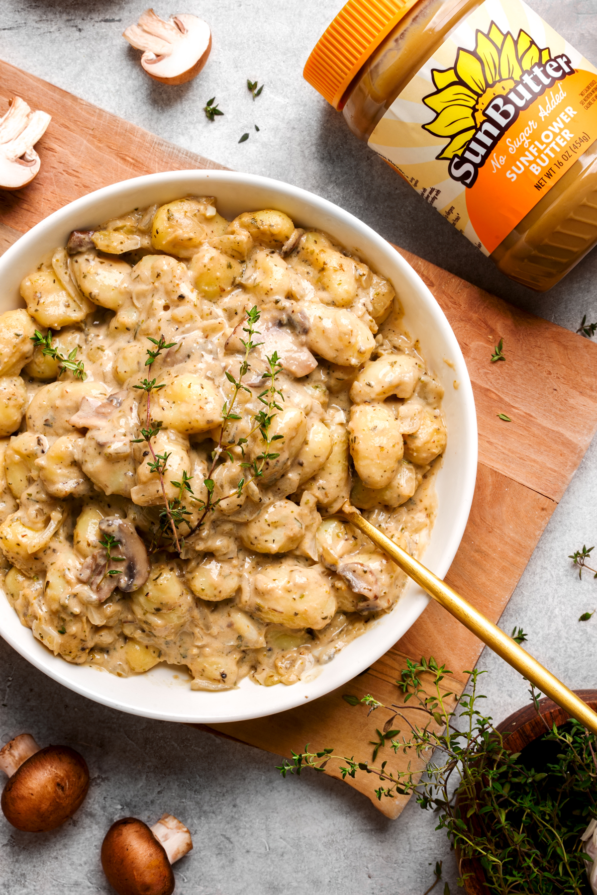 looking down at the creamy vegan vegan gnocchi with the sunbutter laying next to it