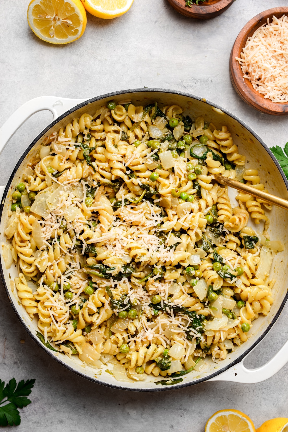 looking down at the pasta with peas with parmesan on top