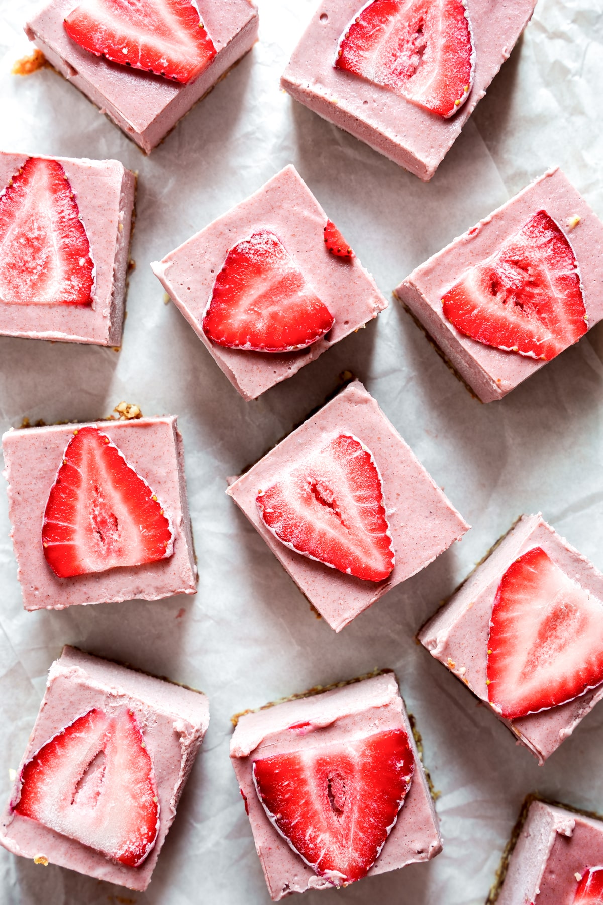looking down at the no-bake strawberry cheesecake bars cut into slices