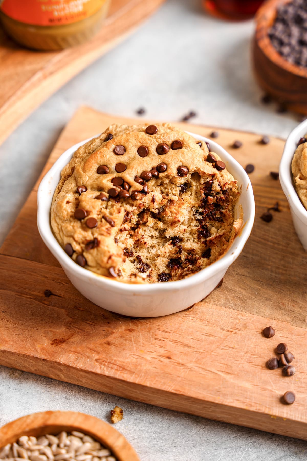 the chocolate chip baked oats with a bite taken out of them to show the fluffy texture