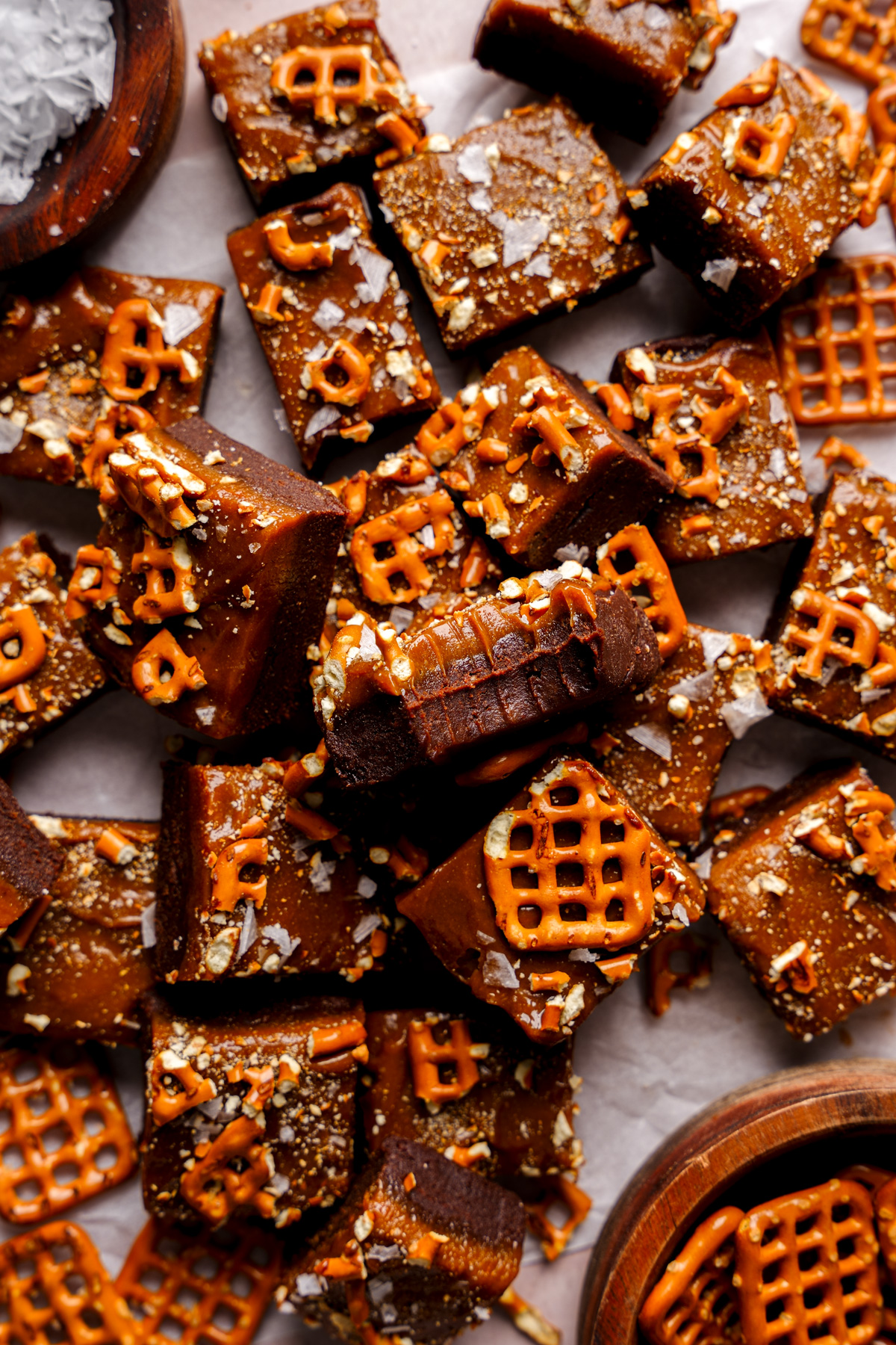a piece of date fudge with a bite taken out of it to show the fudgy texture
