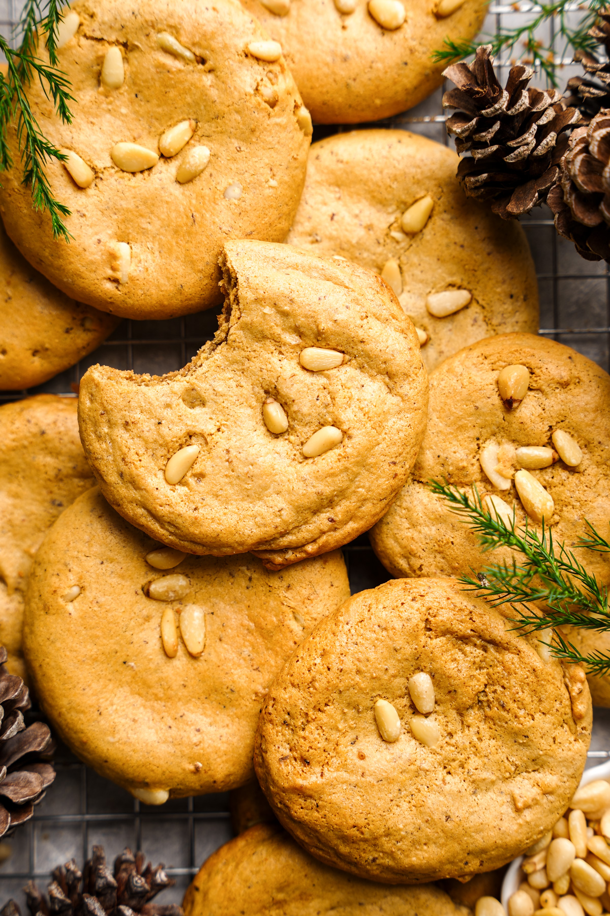 the pine nut cookies with a bite taken out of one
