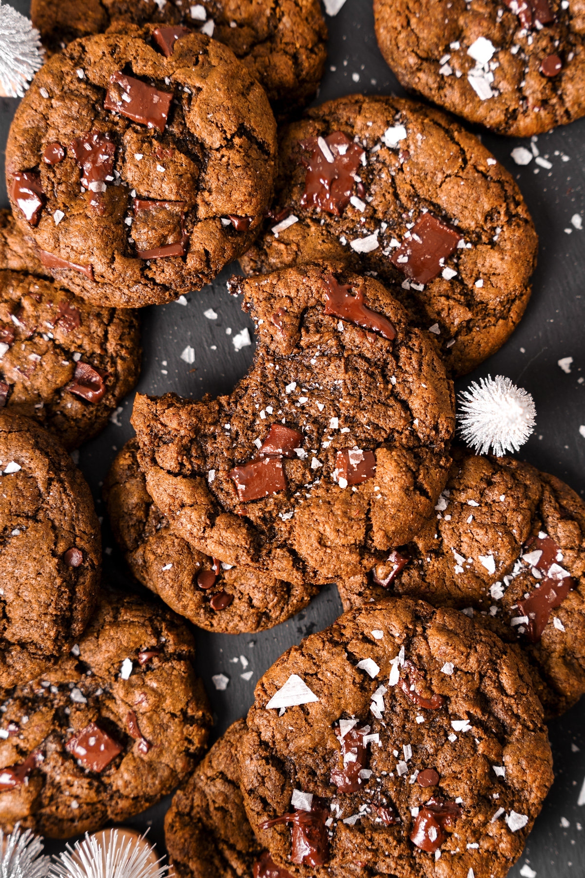 the healthy sunbutter cookies laying flat with sea salt sprinkled on top of the melted chocolate