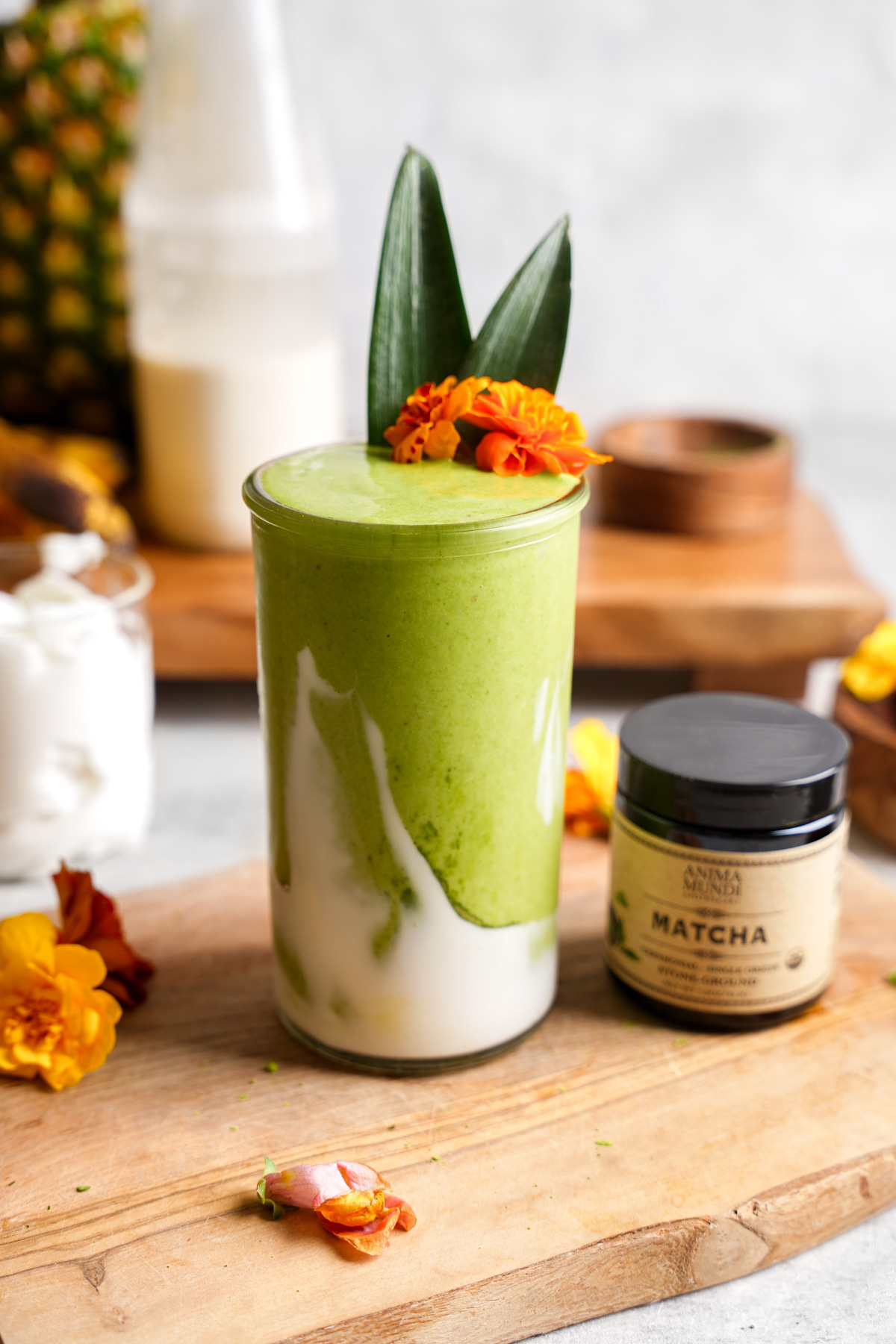 the matcha smoothie next to the anima mundi matcha and edible flowers