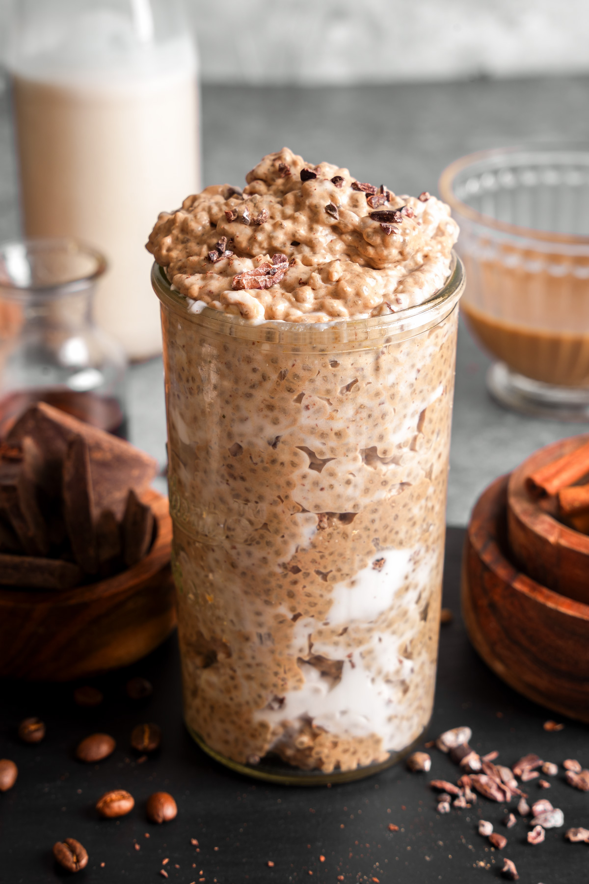 a close up of the chia pudding with cacao nibs on top