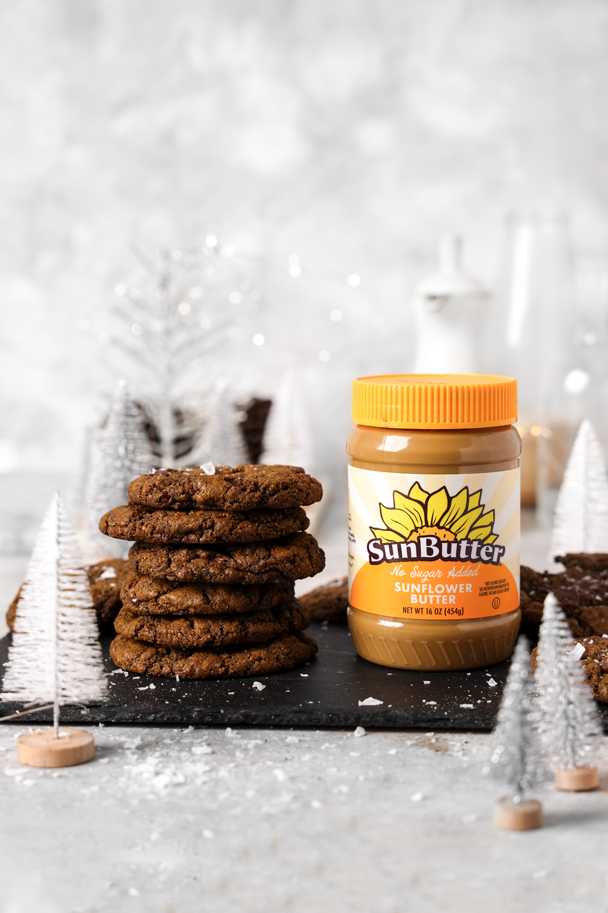 the sunbutter cookies stacked on top of each other next to the sunbutter sunflower seed butter